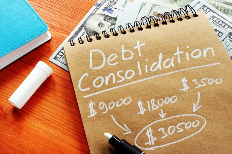 A notepad that says "debt consolidation" above several listed dollar amounts added together
