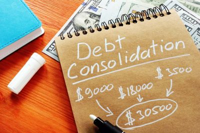 A notepad that says "debt consolidation" above several listed dollar amounts added together