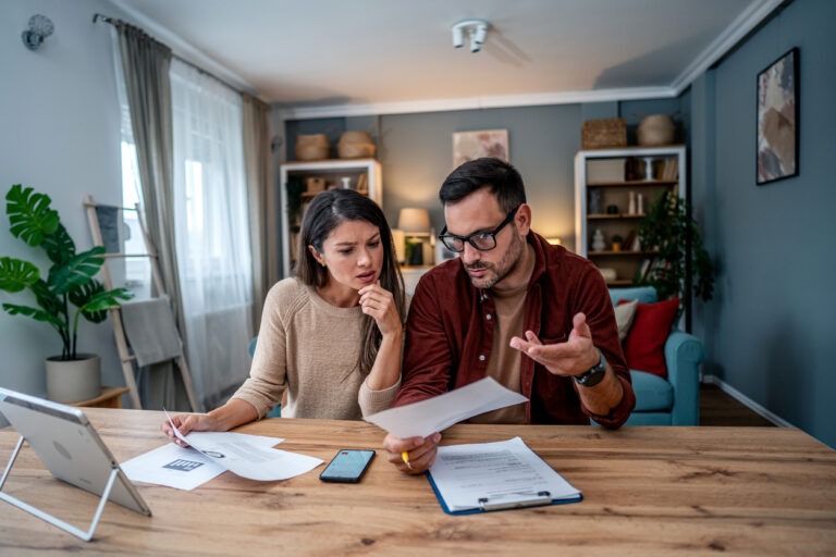 Young couple stressed looking for personal loan