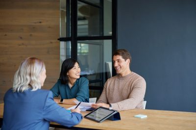 Customers at bank listening to financial offers from bank