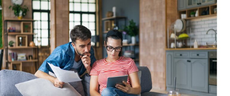 Couple looking at credit score after debt consolidation
