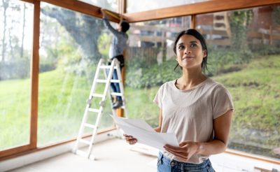 Woman renovating house with money from home equity