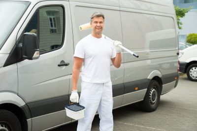 Painter Standing In Front Of Van