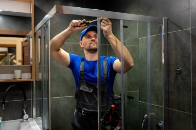 Licensed contractor working on shower installation