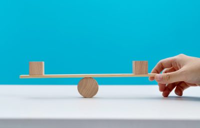 Blank cubes on wooden seesaw