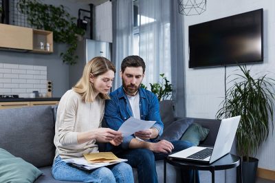 Man and woman looking at credit score report