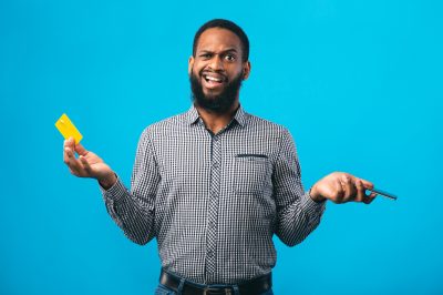 man with phone and credit card