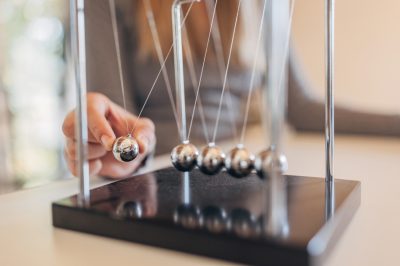 Newton's cradle, perpetual motion