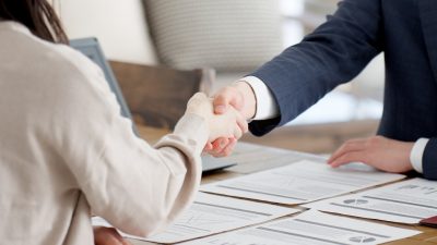 Shaking of hands after agreeing to settlement terms
