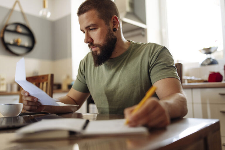 Man looking at financial agreement looking at cash advance limit