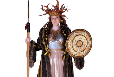 Viking queen Brita wearing an ornate crown and holding a shield and spear