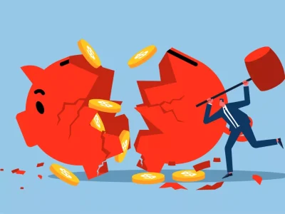 man breaking piggy bank